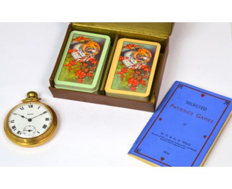 Smiths; a plated open faced pocket watch, the dial set with Roman numerals and a vintage boxed game of patience (2).