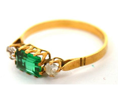 A yellow metal ring set with green rectangular stone and white stone either side, size L, approx 1.5g.