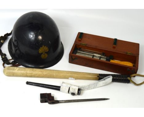 A collectors lot comprising early 20th century bayonet, mid 20th century ebonised tin helmet with brass 'R.F' mount to front,