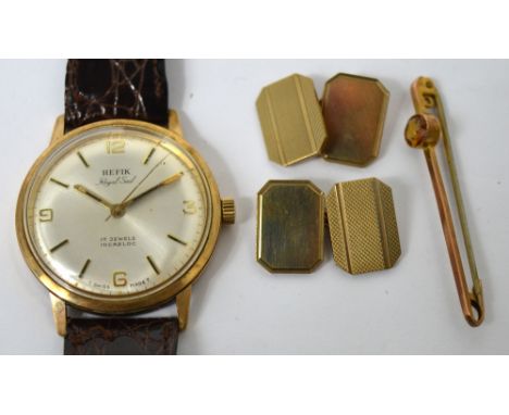 A pair of 9ct yellow gold cufflinks with engine turned decoration, a 9ct gold bar brooch set with an amber coloured stone and