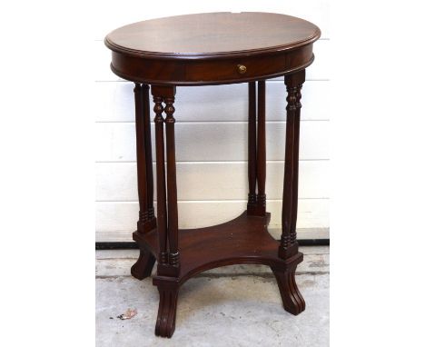 A c.1900 mahogany oval hall table with central drawer over four double turned supports to lower curving shelf on splayed feet