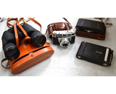 A leather cased Houghton-Butcher Co. of London fold out Ensign camera, two vintage Kodak cameras and a set of cased Viper 10 