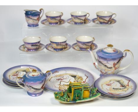 A 20th century Japanese porcelain tea service with Geisha girl lithophane and a decorative Oriental ceramic model of a green 