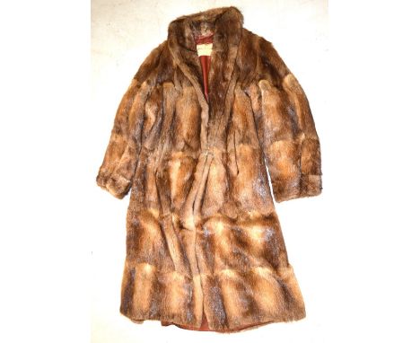 A vintage lady's musquash full length coat bearing label for William Creamer and Company of Liverpool and Chester.