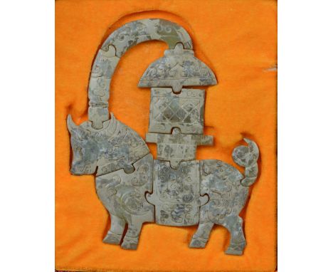 A Chinese jade and included puzzle with incised decoration throughout, possibly Han dynasty, height 22cm.