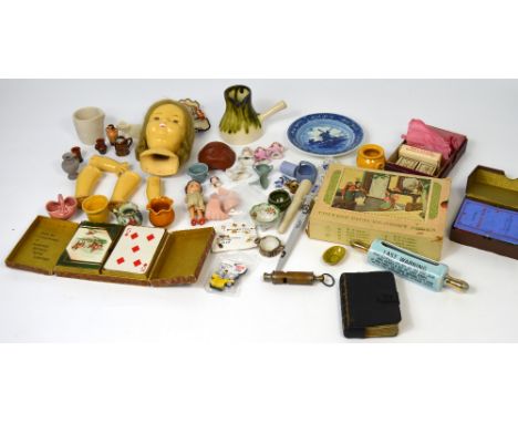 A collectors lot to include miniature ceramics, a small German bisque dolls head, a collection of Chinese picture story books