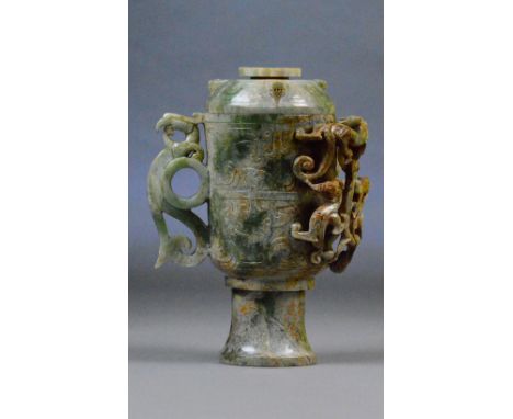 A Chinese jade and russet included cup and cover, the pierced handle modelled as a stylised phoenix with chilong pierced deco