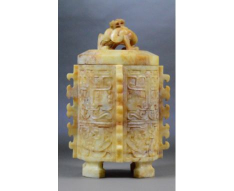 A large pale jade and pale russet included cylindrical jar and cover the cover set with a stylised dragon above the main body
