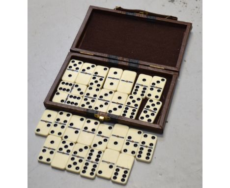A cased set of vintage dominoes.