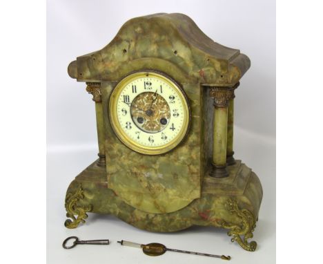 A 19th century green agate marble eight day mantel clock, enamel dial set with Arabic numerals flanked either side by twin pi