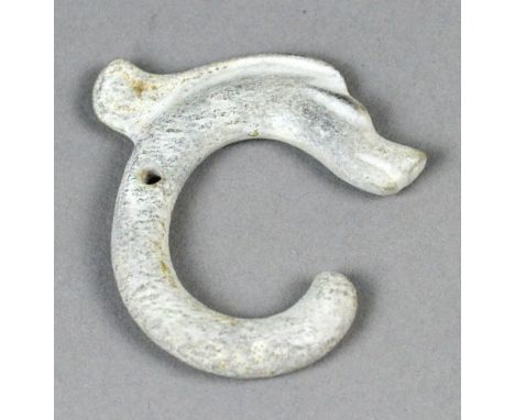A 'C' shaped stylised dragon calcified jade, possibly neolithic hongshan wenhua, height 5cm.