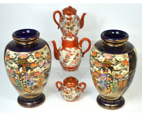 A pair of 20th century blue ground and gilt heightened vases, decorated with geisha girls, height of both 32cm and a Japanese