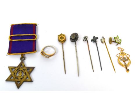 A masonic jewel, a 9ct gold cased stick pin with shield shaped finial, a yellow metal stick pin set with seed pearls and amet