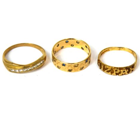 A 9ct gold band set with blue and white stones, size N, a Mizpah ring, size N, a 9ct gold ring set with white stones, size R,