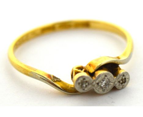 A 9ct gold three stone diamond ring on a twist, size N, approx 2.1g.