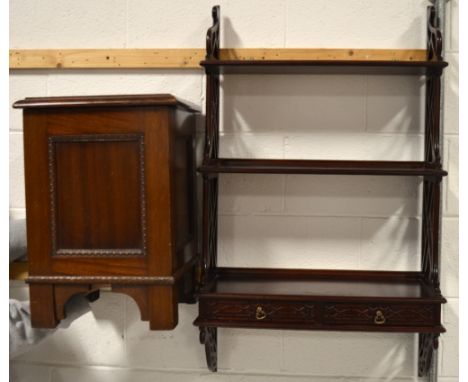 A mahogany Oriental inspired wall mounted book shelf with two lower drawers, 52cm and an oak pot cupboard/bedside cabinet on 