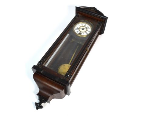 A late 19th early 20th century mahogany cased Vienna style wall clock of small proportions, the enamel dial set with Roman nu