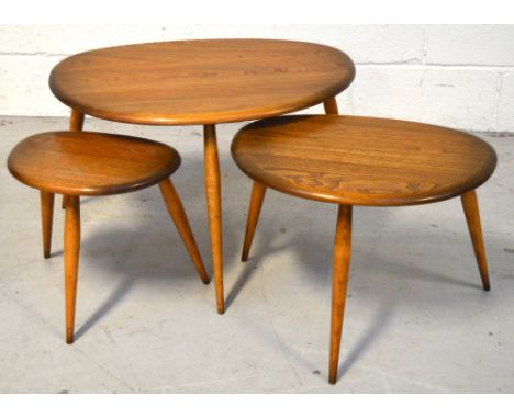 A retro Ercol nest of three "pebble" tables, width of largest 65cm (one af). CONDITION REPORT Middle table has an approx 35cm