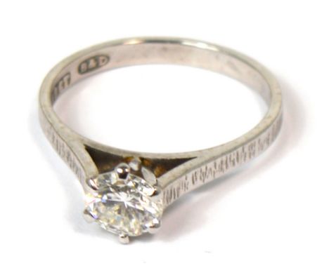 An 18ct white gold Boodle & Dunthorne engagement ring set with a round brilliant cut diamond, six mirrored claw setting, tape