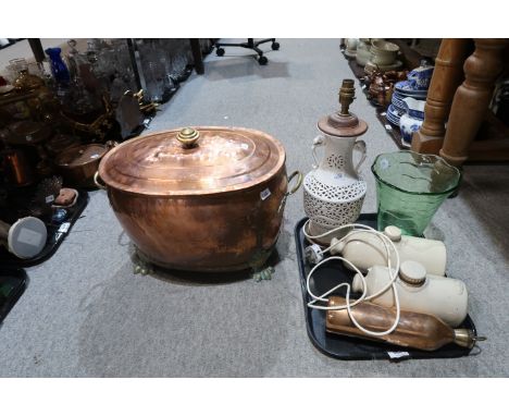 A large copper storage bucket upon claw feet, a porcelain lamp with pierced body, a green glass vase, Govancroft stoneware ho