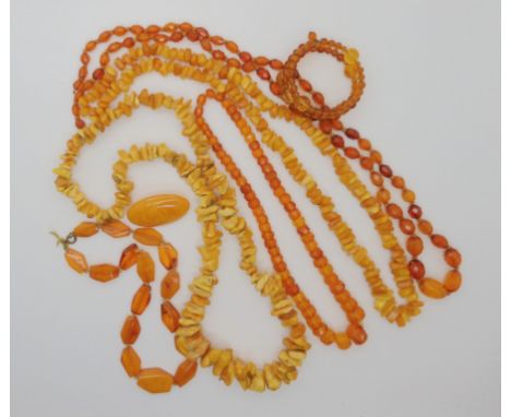 A collection of amber and amber coloured beads weight combined 176.9gms and a glass bead bangle Condition Report: Not availab