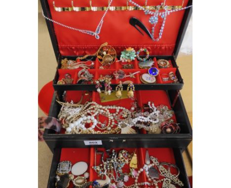 A collection of vintage costume jewels in a jewellery box Condition Report: Not available for this lot