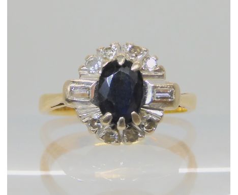 A bright yellow metal sapphire and diamond cluster ring size H, weight 2.6gms Condition Report: Available upon request