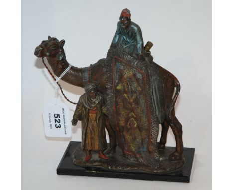 A 20th century cast metal and painted table lighter, The Carpet Seller, 14cm wide Condition Report: Available upon request