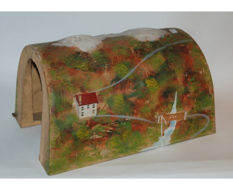 A Lionel &amp; Co tinplate tunnel with painted scene, 37cm wide x 24cm high Condition Report: Available upon request