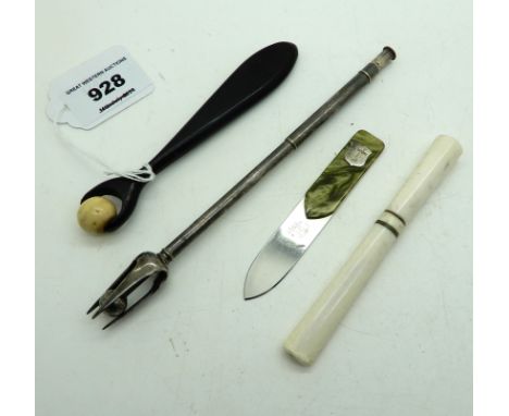 A lot comprising a cigarette holder, a letter opener, a pickle fork &amp; a roller tool Condition Report: Available upon requ