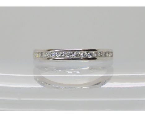 An 18ct white gold diamond set eternity ring, set with estimated approx 0.33cts of brilliant cut diamonds, finger size O1/2, 