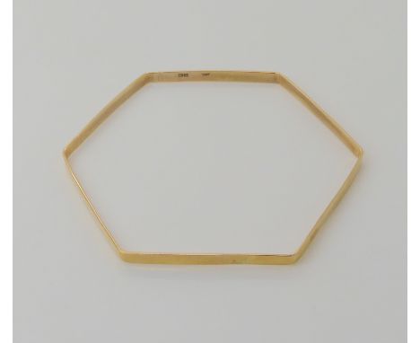 A 9ct gold hexagonal bangle dimensions across the inner 6.8cm, from point to point 7.7cm, 7.1gms Condition Report: Available 