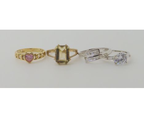 Four 9ct gold rings, pink cz heart size M., smoky quartz O1/2, and a cz solitaire size M1/2, and a further cz cluster ring, s