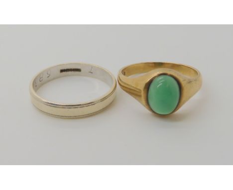 A 9ct gold green agate set ring, size S, together with a 9ct white gold wedding ring size U, weight together 7.1gms Condition