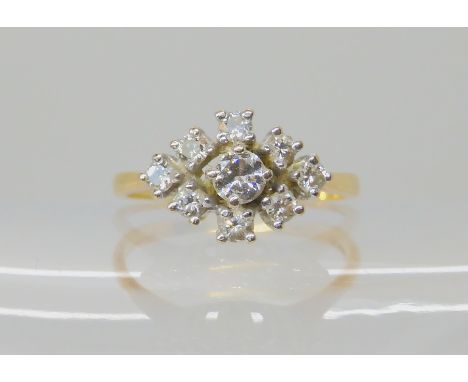 An 18ct gold diamond cluster ring set with estimated approx 0.40cts of brilliant cuts, size L1/2, weight 2.6gms Condition Rep