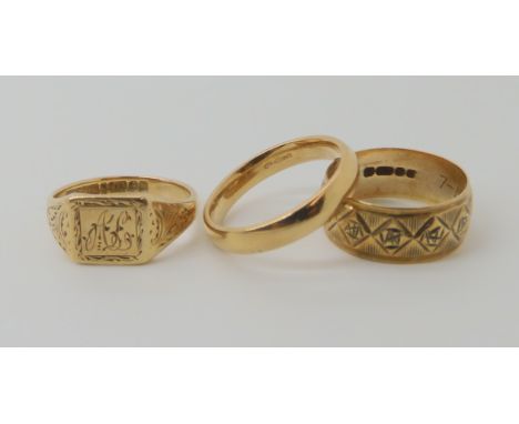 A 9ct gold signet ring, size K, a 9ct court wedding ring, size K1/2, and a 9ct gold wide wedding ring size J1/2 weight combin