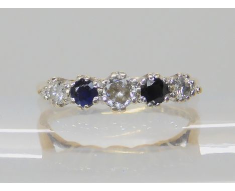 A 9ct gold sapphire and diamond five stone ring, total diamond content estimated approx 0.15cts, finger size M1/2, weight 2.1