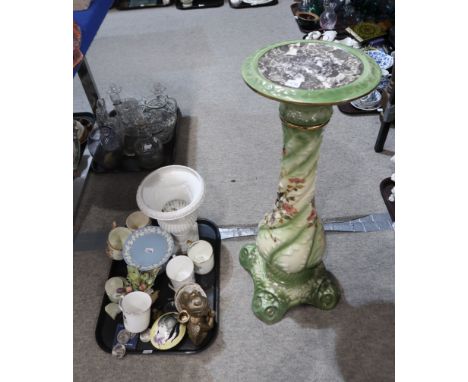 A green jardiniere stand of baluster form decorated with birds amongst foliage, a white glazed urn, a Wedgwood Queensware taz