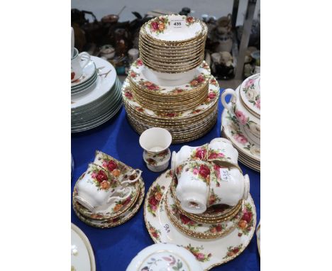 A Royal Albert Old Country Roses tea and dinner service comprising twelve dinner plates, eleven medium plates, six cups, sauc
