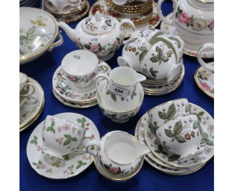 A Wedgwood Strawberry Hill pattern teaset comprising six cups, saucers and plates, milk jug and sugar bowl, together with a H