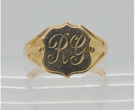 A 9ct gold gents shield shaped signet ring, size X, weight 6.9gms Condition Report: Available upon request