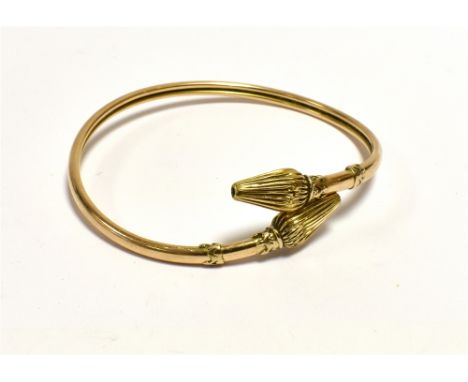 ANTIQUE 9CT GOLD TORQUE BANGLE  Wrap around torque style bangle, 3.5mm wide, with lotus bud and coronet motif terminals.  Sta