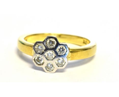 18CT GOLD &amp; DIAMOND DRESS RING  9.1mm diameter white gold hexagonal floral cluster head, set with round brilliant cut dia