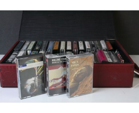 Cassettes - Case containing 32 cassette tapes to include Rolling Stones, Eagles, Simply Red etc