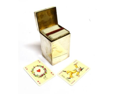 AN EDWARDIAN SILVER PLAYING CARDS BOX with a hinged cover and an internal red-leather-covered division for two packs of small