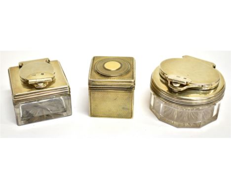 THREE VICTORIAN SILVER-MOUNTED CLEAR-GLASS TRAVELLING INK WELLS comprising; a glass-lined silver-gilt square example, all-ove