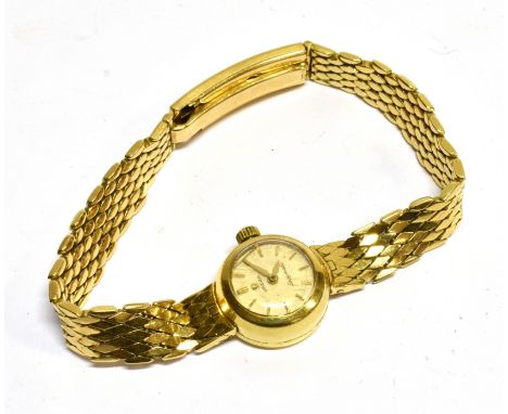 OMEGA, LADYMATIC, A LADY'S 18CT GOLD BRACELET WATCH CIRCA 1965  No. 976831, the cream dial with raised gilt baton numerals an