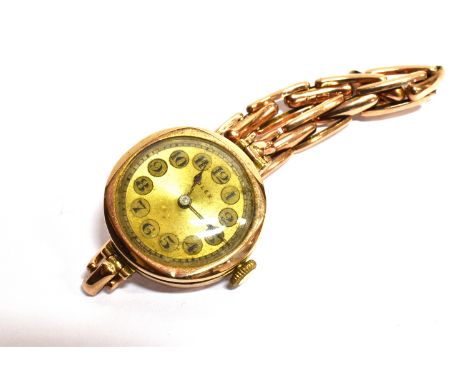 ROLEX, A LADY'S 9CT GOLD ROUND BRACELET WATCH CIRCA 1924, the gilt dial with engine-turned 'rings' and a black Arabic chapter