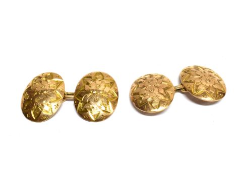 A PAIR OF LATE VICTORIAN 9CT ROSE GOLD OVAL TWIN-PANEL CUFFLINKS each domed-oval panel engraved with flowers within a star-sh