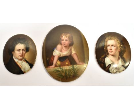 A GROUP OF THREE GERMAN PAINTED-PORCELAIN PORTRAIT PLAQUES two of the slightly-domed oval plaques each depicting a three-quar